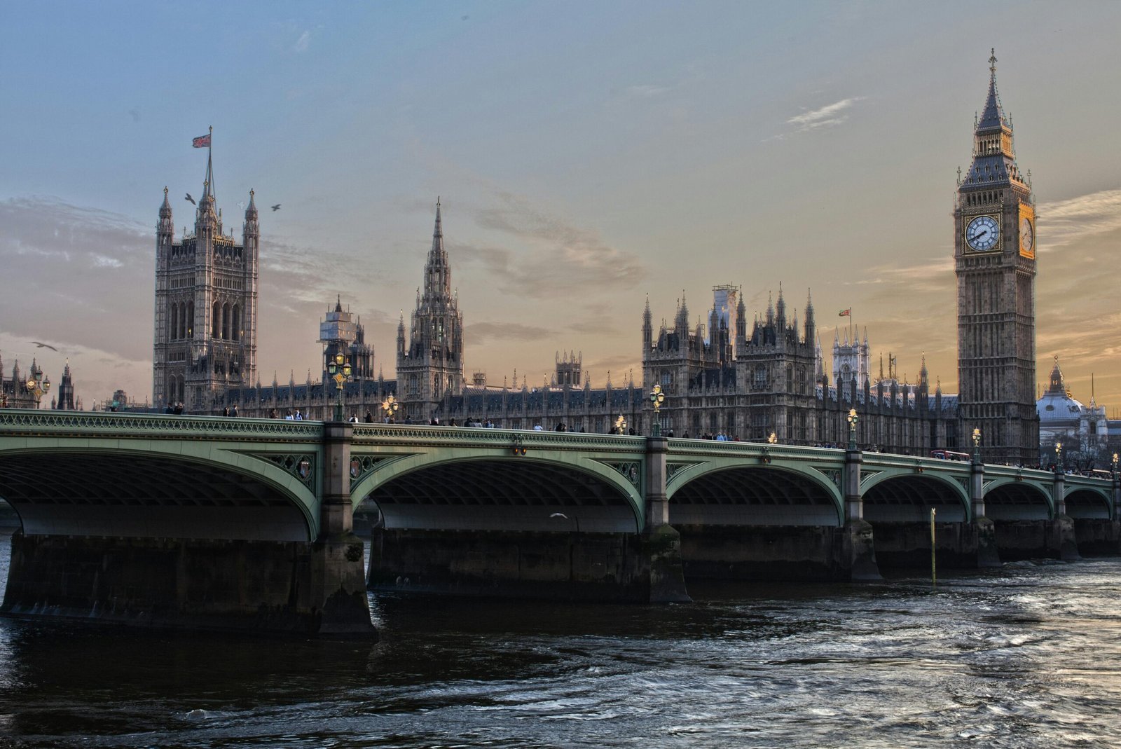 Stunning view of Big Ben and Westminster Bridge at sunset. Iconic London landmark.